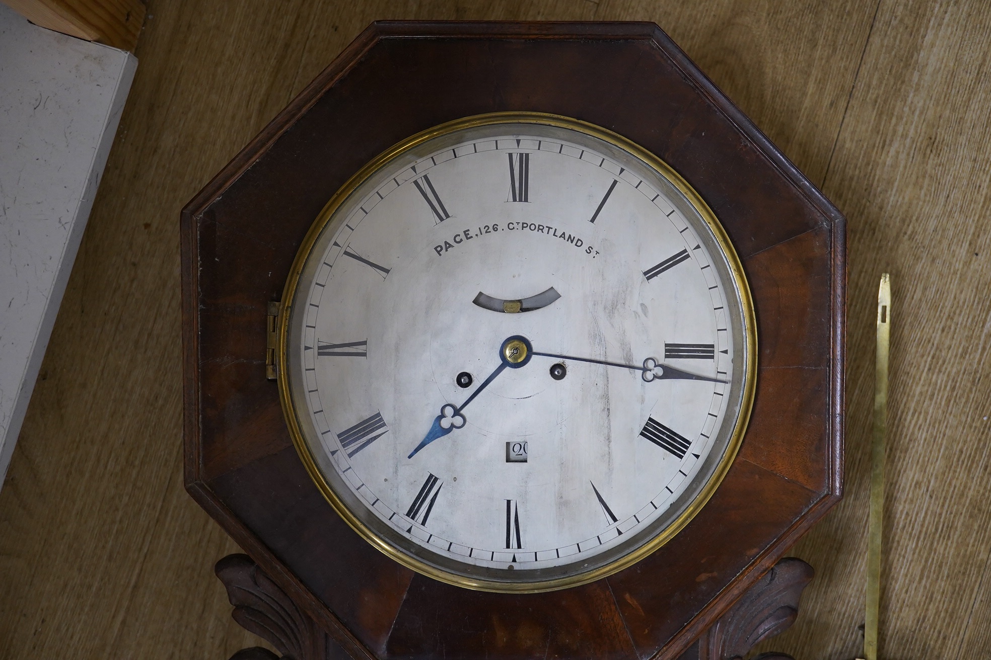 An unusual early Victorian drop dial wall clock, by Pace 126, Gt. Portland Street wall clock, twin fusee striking on a bell with visible pendulum bob and key, 53cm high. Condition - fair, untested